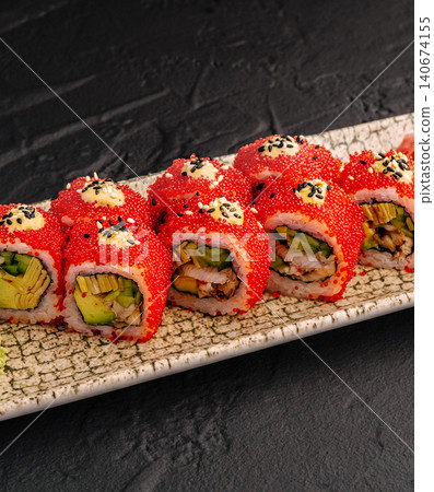 Sushi rolls with tobiko, avocado, and unagi Sushi rolls with tobiko, avocado, and unagi 140674155
