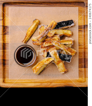 Eggplant fries with dipping sauce on wood board 140674175