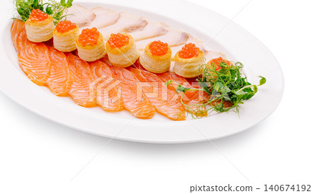 Salmon platter with red caviar vol-au-vents and white fish slices Salmon platter with red caviar vol-au-vents and white fish slices 140674192