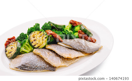 Grilled sea bass fillets with healthy vegetables plate Grilled sea bass fillets with healthy vegetables plate 140674193