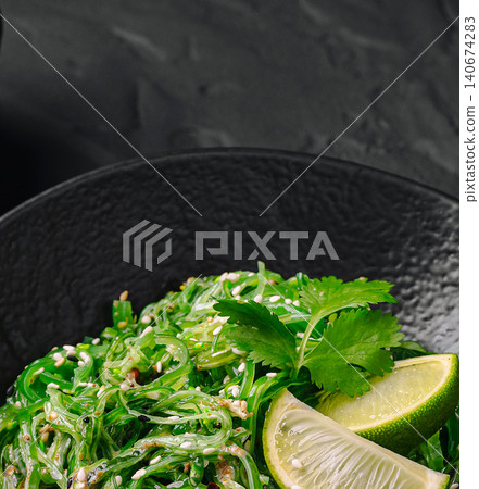 Chuka wakame seaweed salad with sesame seeds and lime Chuka wakame seaweed salad with sesame seeds and lime 140674283
