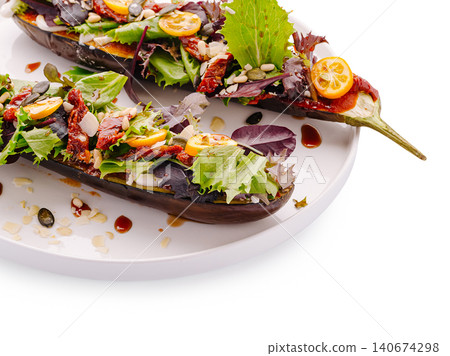 Roasted eggplant salad with kumquat and sundried tomatoes 140674298