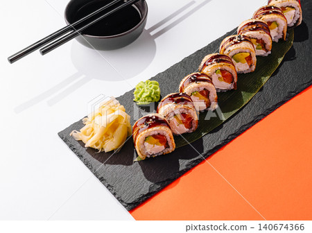 Unagi sushi rolls serving on black slate plate Unagi sushi rolls serving on black slate plate 140674366