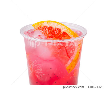 Pink grapefruit beverage in plastic cup with ice and chia seeds 140674423