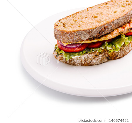 Chicken sandwich with fresh vegetables on white plate Chicken sandwich with fresh vegetables on white plate 140674431