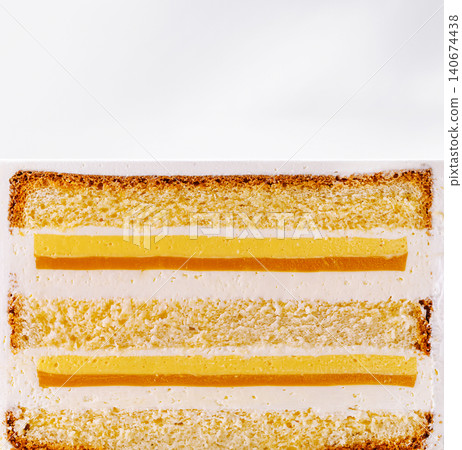 Slice of layered vanilla cake with mango lemon curd Slice of layered vanilla cake with mango lemon curd 140674438