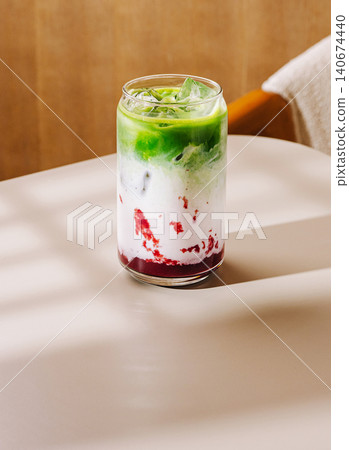 Iced strawberry matcha latte layering milk and fruit Iced strawberry matcha latte layering milk and fruit 140674440