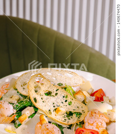 Shrimp caesar salad with croutons and fresh tomatoes Shrimp caesar salad with croutons and fresh tomatoes 140674470