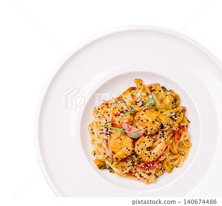 Stir frying shrimp noodles with sesame seeds and vegetables Stir frying shrimp noodles with sesame seeds and vegetables 140674486