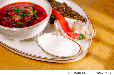 Traditional ukrainian borscht soup served with sides Traditional ukrainian borscht soup served with sides 140674525