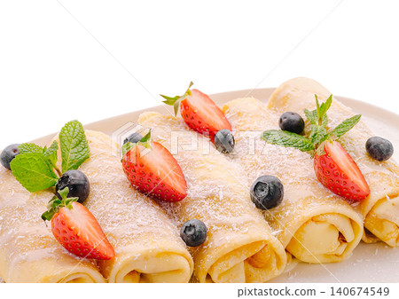 Crepes with strawberries blueberries mint dessert Crepes with strawberries blueberries mint dessert 140674549