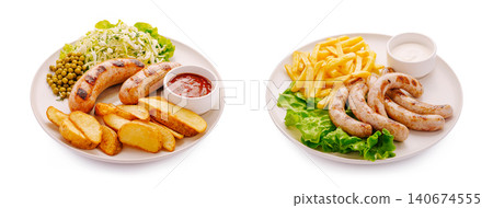 Grilled sausages with french fries and potato wedges side dishes Grilled sausages with french fries and potato wedges side dishes 140674555