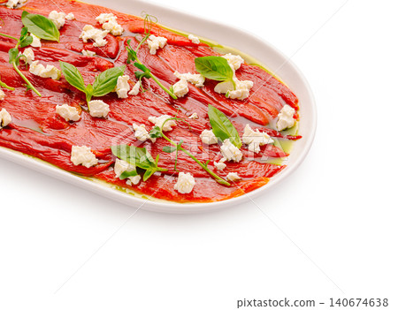 Roasted red peppers with feta, basil, and olive oil appetizer 140674638