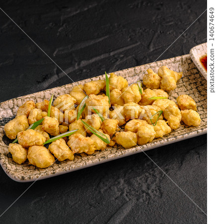 Crispy golden fried chicken popcorn appetizer Crispy golden fried chicken popcorn appetizer 140674649