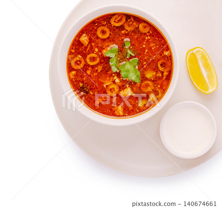 Solyanka soup russian cuisine with lemon and sour cream Solyanka soup russian cuisine with lemon and sour cream 140674661