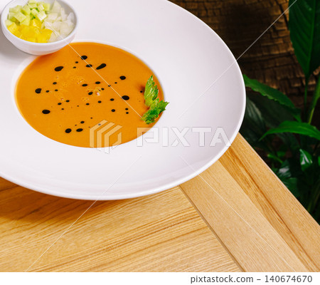 Gazpacho cold soup with balsamic glaze and fresh toppings 140674670