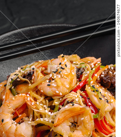 Shrimp chow mein with noodles, vegetables, and sesame seeds Shrimp chow mein with noodles, vegetables, and sesame seeds 140674677