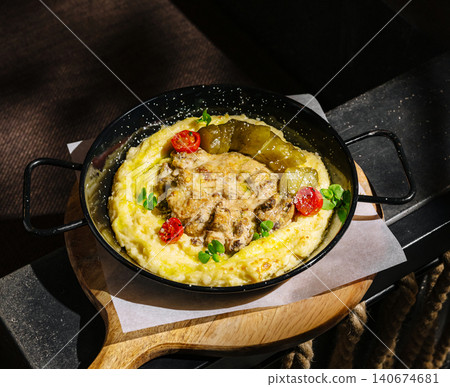 Beef stroganoff with mashed potatoes and pickles in skillet Beef stroganoff with mashed potatoes and pickles in skillet 140674681