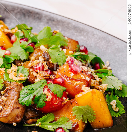 Roasted butternut squash salad with cilantro and pomegranate seeds Roasted butternut squash salad with cilantro and pomegranate seeds 140674696