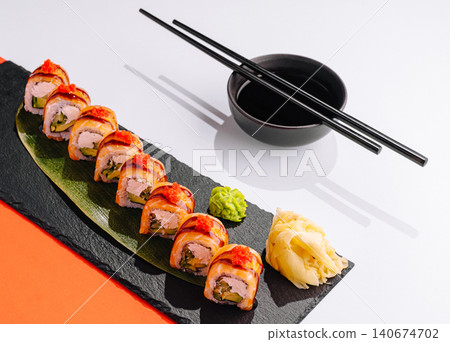 Sushi rolls with salmon, avocado, cream cheese, and tobiko Sushi rolls with salmon, avocado, cream cheese, and tobiko 140674702