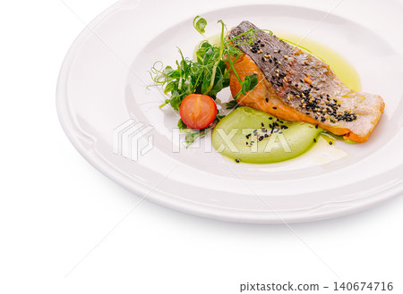 Grilled salmon fillet with pea puree and sesame seeds Grilled salmon fillet with pea puree and sesame seeds 140674716
