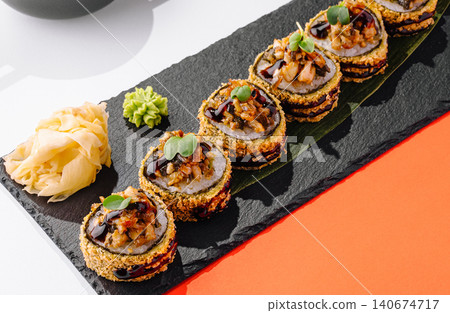 Fried tempura sushi rolls with unagi sauce and ginger Fried tempura sushi rolls with unagi sauce and ginger 140674717
