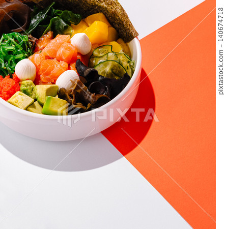 Colorful poke bowl with salmon, mango, and avocado Colorful poke bowl with salmon, mango, and avocado 140674718
