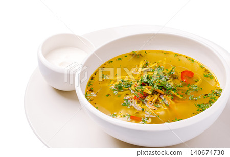 Chicken noodle soup with fresh herbs and sour cream Chicken noodle soup with fresh herbs and sour cream 140674730