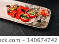 Sushi rolls with masago and black fish roe served with ginger 140674742