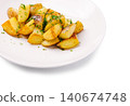 Roasted potato wedges serving on white plate 140674748