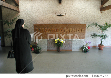 A nun prays at the tomb in the sanctuary of St. Leopold Mandic (Santuario di San Leopoldo Mandic) in Padua, Italy on March 02, 2005. A nun prays at the tomb in the sanctuary of St. Leopold Mandic (Santuario di San Leopoldo Mandic) in Padua, Italy on March 02, 2005. 140674786
