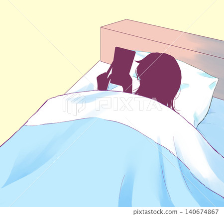 Silhouette of a woman using her smartphone in bed Silhouette of a woman using her smartphone in bed 140674867