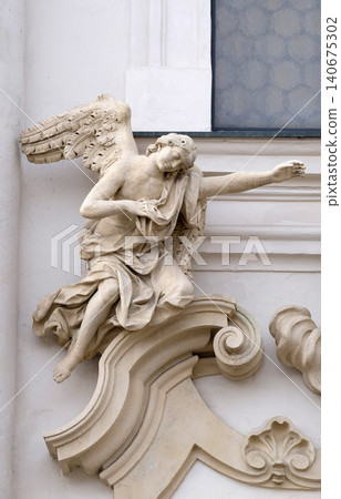 Angel on the portal of Mariahilf church in Graz, Styria, Austria on January 10, 2015. Angel on the portal of Mariahilf church in Graz, Styria, Austria on January 10, 2015. 140675302