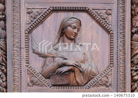Saint, wooden door of the Basilica of Santa Croce (Basilica of the Holy Cross) in Florence, Italy Saint, wooden door of the Basilica of Santa Croce (Basilica of the Holy Cross) in Florence, Italy 140675310