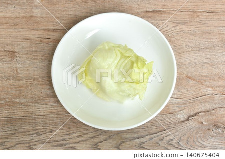 Iceberg or crisphead lettuce fresh vegetable salad on plate Iceberg or crisphead lettuce fresh vegetable salad on plate 140675404