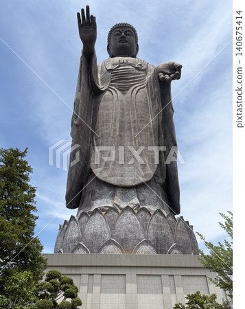 The Ushiku Daibutsu (Great Buddha of Ushiku) and the blue sky as seen from below. The Ushiku Daibutsu (Great Buddha of Ushiku) and the blue sky as seen from below. 140675414