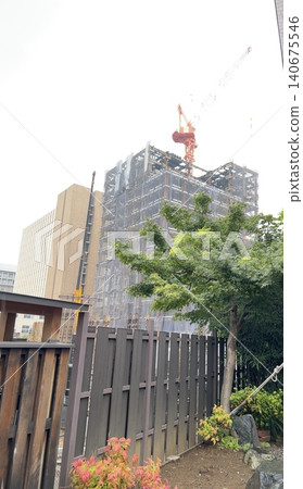 A scene with a crane during large-scale renovation work. 140675546