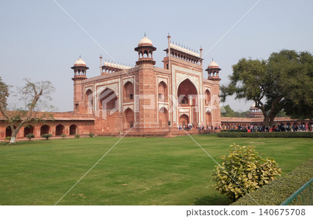 Gate to the Taj Mahal (Crown of Palaces), an ivory-white marble mausoleum in Agra, Uttar Pradesh, India Gate to the Taj Mahal (Crown of Palaces), an ivory-white marble mausoleum in Agra, Uttar Pradesh, India 140675708