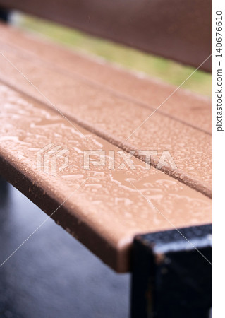 Detailed texture of water droplets on a brown wooden surface, abstract nature background with bokeh Detailed texture of water droplets on a brown wooden surface, abstract nature background with bokeh 140676610