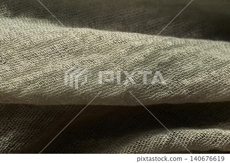 Detailed close-up of a woven metallic grid with realistic texture and deep shadows Detailed close-up of a woven metallic grid with realistic texture and deep shadows 140676619