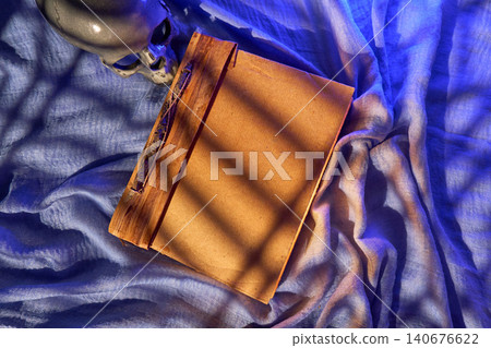 Nighttime creative glow. Serene scene with poetic focus. Tranquil ambiance with writer immersed in silent thought and inspiration 140676622