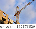 Tower crane cabin and mast at a high-rise building site 140676629