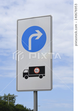 Mandatory directional turn traffic sign for trucks over height limit Mandatory directional turn traffic sign for trucks over height limit 140676953