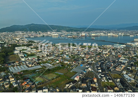 An aerial photograph overlooking the port city and coastline around Miho no Matsubara in Shizuoka Prefecture. An aerial photograph overlooking the port city and coastline around Miho no Matsubara in Shizuoka Prefecture. 140677130