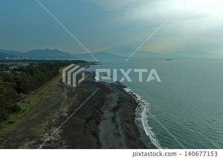 An aerial photograph taken at dawn, capturing the black sand beach and coastline of Miho no Matsubara Beach in Shizuoka Prefecture. An aerial photograph taken at dawn, capturing the black sand beach and coastline of Miho no Matsubara Beach in Shizuoka Prefecture. 140677153