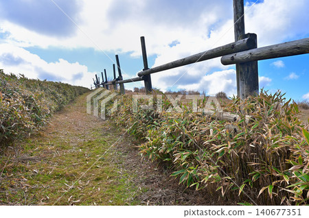 Clouds drifting across the grassy ridge trail near Nishina Pass on the Izu Mountain Ridge Trail, Izu Peninsula. Clouds drifting across the grassy ridge trail near Nishina Pass on the Izu Mountain Ridge Trail, Izu Peninsula. 140677351