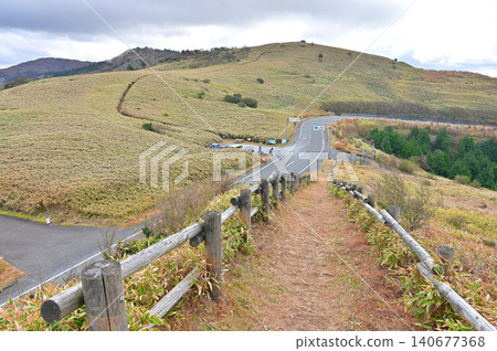 Nishina Pass on the Izu Mountain Ridge Trail, Izu Peninsula: A ridge trail that crosses a road through a grassland. Nishina Pass on the Izu Mountain Ridge Trail, Izu Peninsula: A ridge trail that crosses a road through a grassland. 140677368