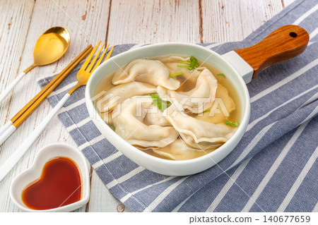 Traditional Chinese Suantang Shuijiao, Dumpling Soup with Vinegar and Chili Oil 140677659