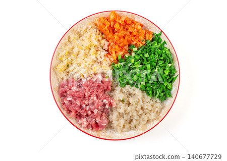 Fresh ingredients for Chinese dumplings Jiaozi filling with minced meat and chopped vegetables Fresh ingredients for Chinese dumplings Jiaozi filling with minced meat and chopped vegetables 140677729