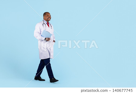 Mature black doctor in white coat with stethoscope and clipboard walking confidently Mature black doctor in white coat with stethoscope and clipboard walking confidently 140677745